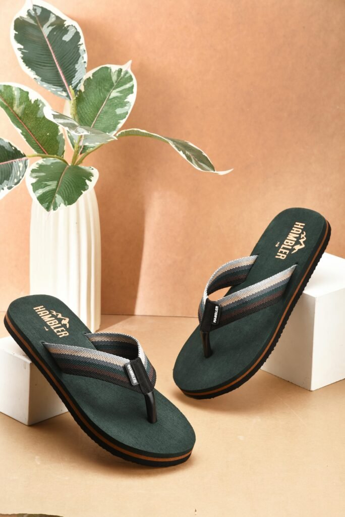 Elegant flip flops displayed in a studio with a minimalist backdrop for fashion appeal.