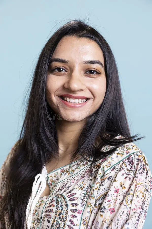portrait smiling indian person posing front camera being happy confident herself upbeat friendly woman 374578693